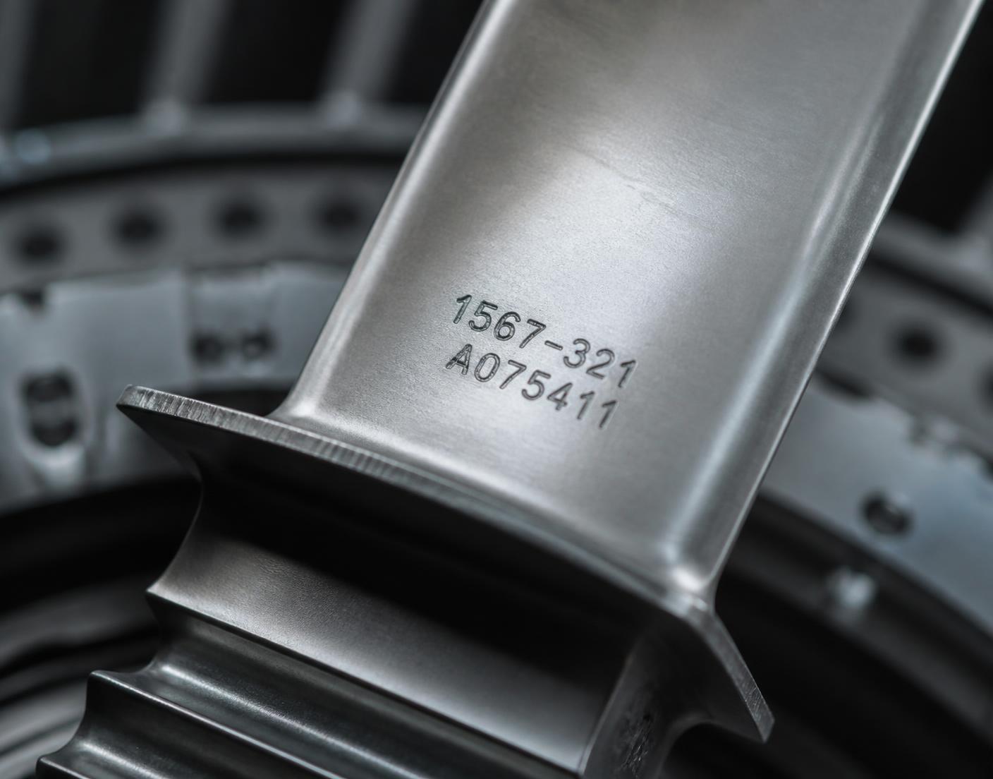Machined titanium turbine blade with a stamped serial number